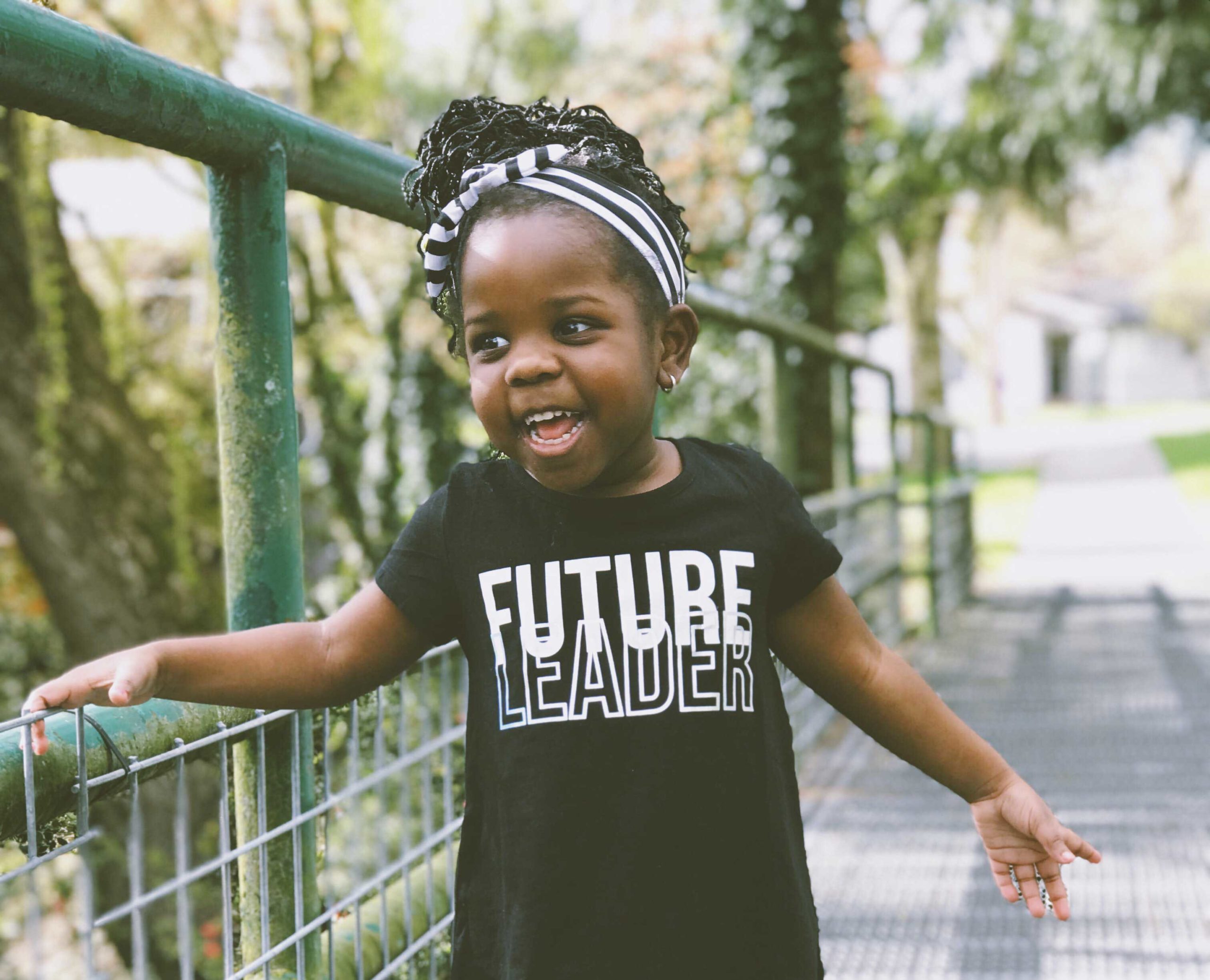 a young girl with a 'future leader' tshirt